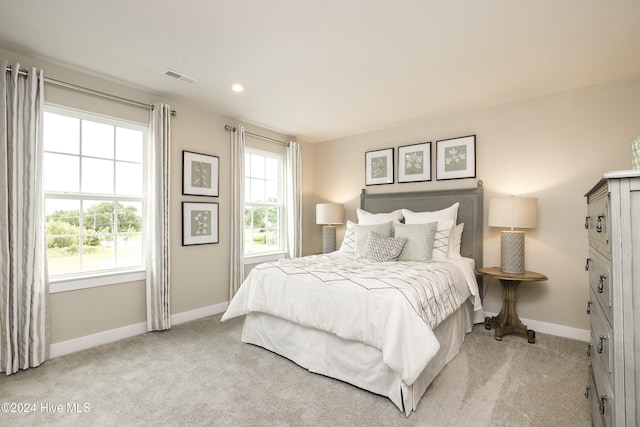 bedroom with light colored carpet