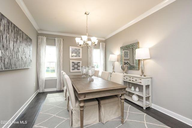 dining area with a notable chandelier, dark hardwood / wood-style flooring, and ornamental molding