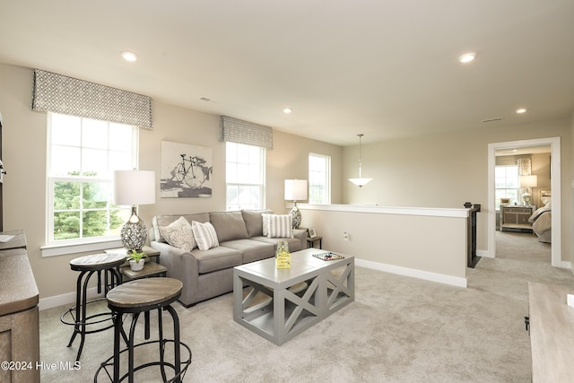 carpeted living room featuring a wealth of natural light