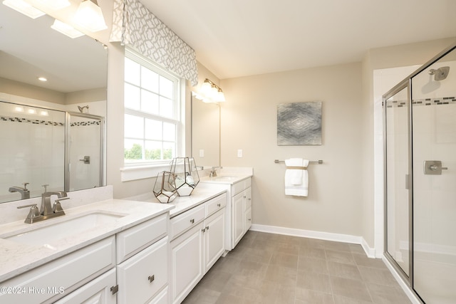 bathroom with a shower with door and vanity