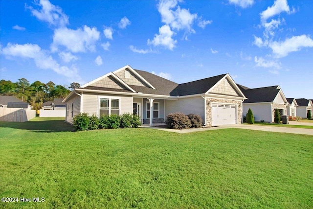 view of front of house with a garage and a front lawn