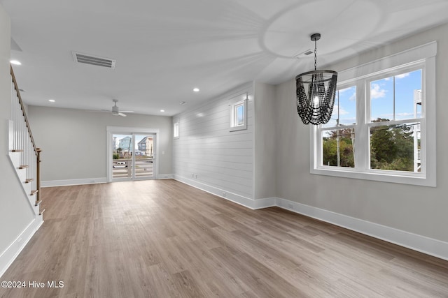 unfurnished dining area with light wood-style flooring, recessed lighting, visible vents, baseboards, and stairs