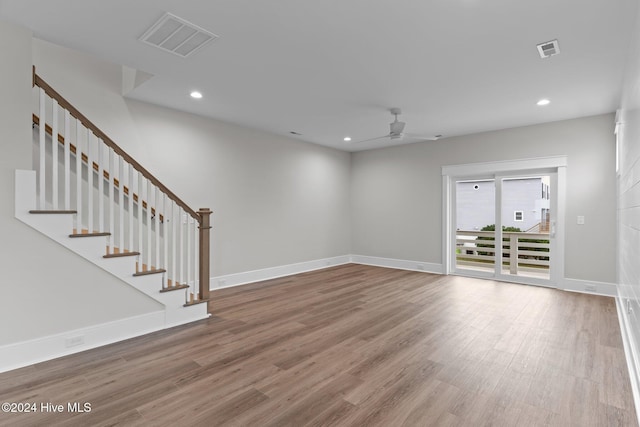 908 Second St S Unit 2, Carolina Beach, NC 28428 - unfurnished living room featuring wood finished floors, ceiling fan, recessed lighting, stairs, and baseboards