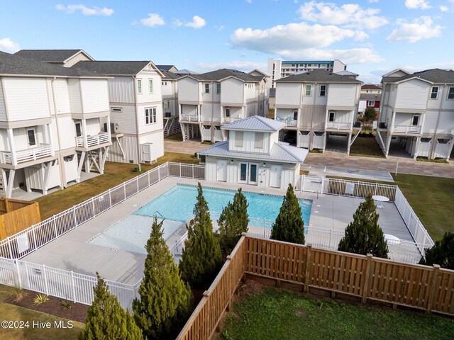 908 Second St S Unit 2, Carolina Beach, NC 28428 - community pool featuring a residential view and a fenced backyard