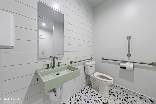 908 Second St S Unit 2, Carolina Beach, NC 28428 - half bathroom featuring toilet and wooden walls