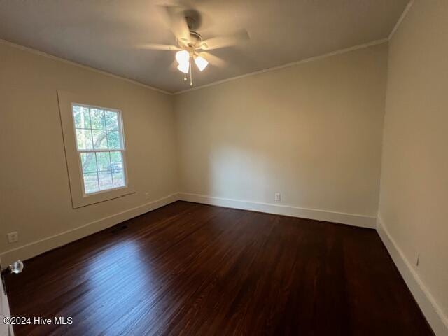 spare room with ceiling fan, dark hardwood / wood-style flooring, and ornamental molding