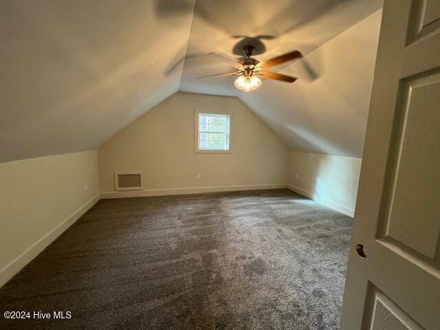 additional living space featuring ceiling fan, carpet floors, and lofted ceiling