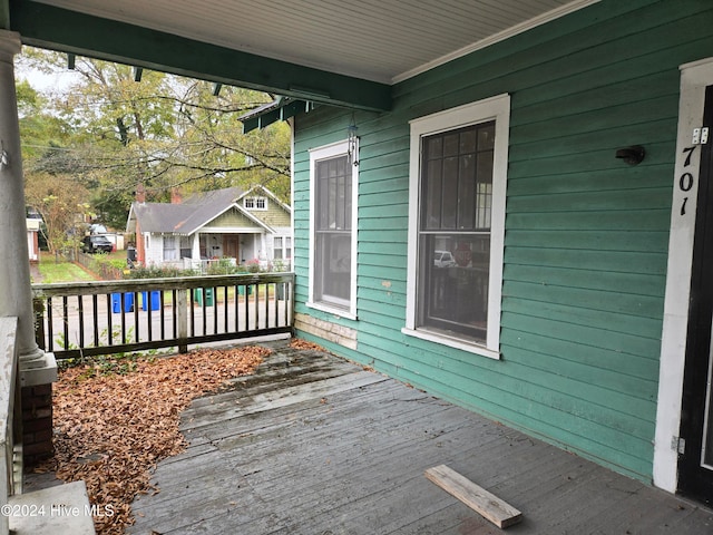 wooden terrace with a porch