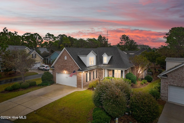 4151 Windham Ln, Southport, NC 28461 - traditional-style house with brick siding, driveway, a yard, and a garage