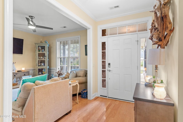 4151 Windham Ln, Southport, NC 28461 - entryway featuring ornamental molding, light wood-style floors, and ceiling fan