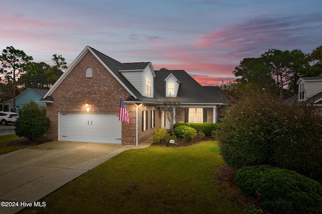 4151 Windham Ln, Southport, NC 28461 - traditional-style house featuring brick siding, concrete driveway, a front yard, and roof with shingles