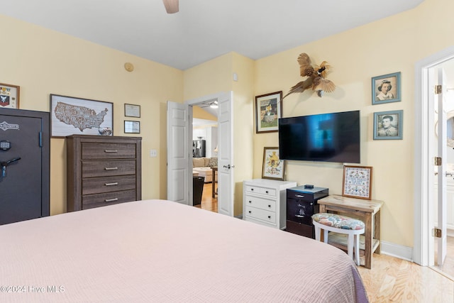 4151 Windham Ln, Southport, NC 28461 - bedroom featuring ensuite bath, wood finished floors, and a ceiling fan