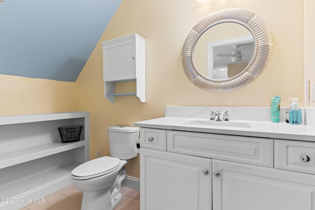 4151 Windham Ln, Southport, NC 28461 - bathroom featuring toilet, vanity, tile patterned floors, and vaulted ceiling