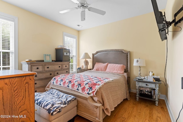 4151 Windham Ln, Southport, NC 28461 - bedroom with light wood-type flooring, baseboards, and a ceiling fan