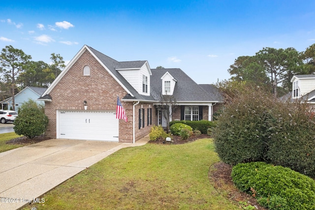 4151 Windham Ln, Southport, NC 28461 - traditional home with brick siding, a front lawn, concrete driveway, an attached garage, and roof with shingles