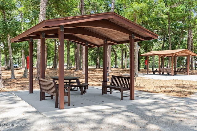 4151 Windham Ln, Southport, NC 28461 - surrounding community with a gazebo and view of wooded area