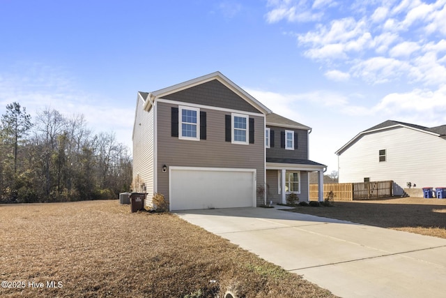 view of property featuring a garage and cooling unit