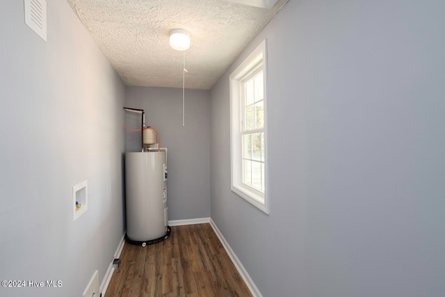 utility room featuring water heater