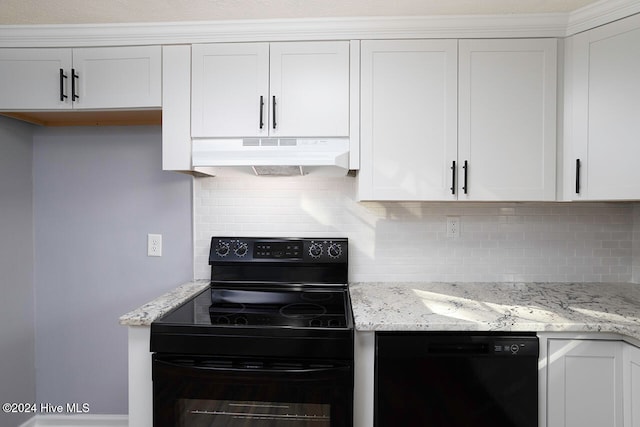 kitchen featuring white cabinets, decorative backsplash, and black appliances