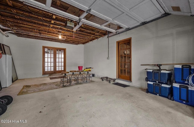 garage featuring french doors and a garage door opener