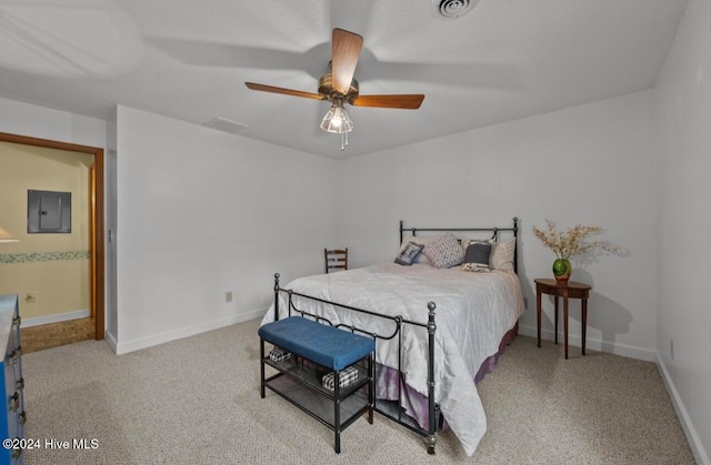 carpeted bedroom with electric panel and ceiling fan