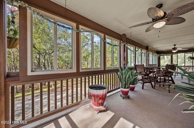 sunroom / solarium with ceiling fan