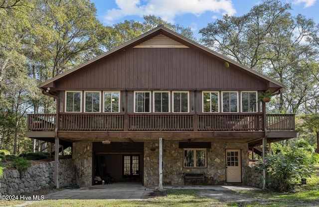 back of house with a wooden deck