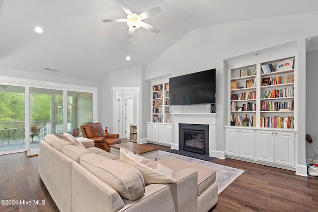 living room featuring vaulted ceiling, ceiling fan, and dark wood-type flooring