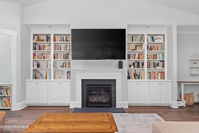 interior space featuring dark wood-type flooring and vaulted ceiling