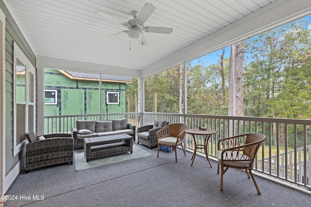 sunroom / solarium with ceiling fan