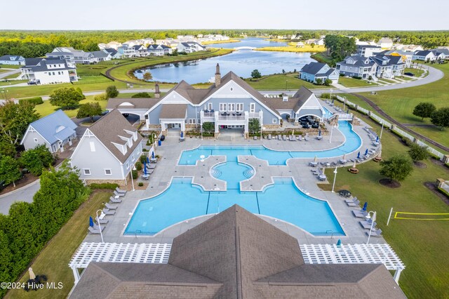 view of swimming pool with a water view