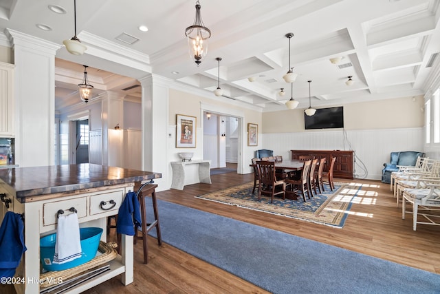 dining area with dark wood-type flooring, a wealth of natural light, and coffered ceiling