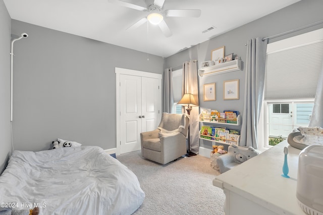 bedroom with ceiling fan and carpet floors