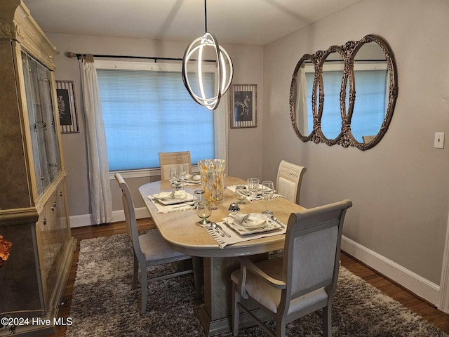 dining space with dark wood-type flooring