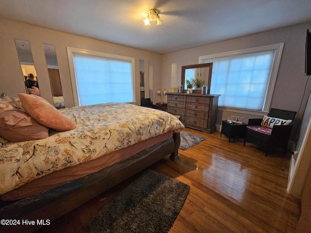 bedroom with hardwood / wood-style floors