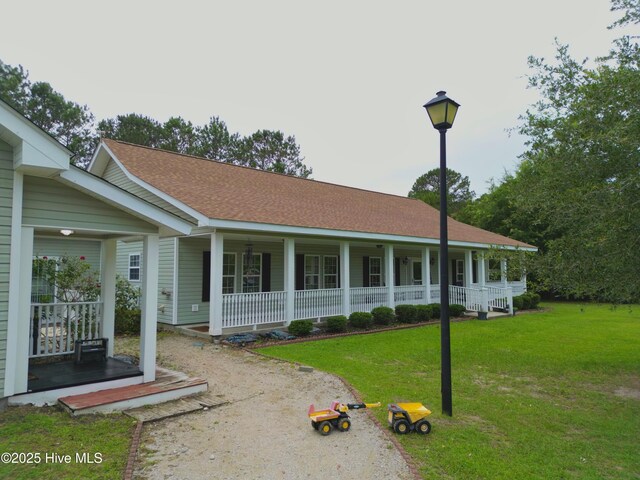 955 Mt Pisgah Rd SW, Supply, NC 28462 - view of front of house featuring covered porch and a front yard