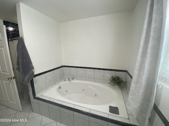 bathroom featuring tile patterned floors and tiled tub