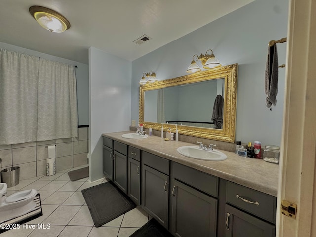 955 Mt Pisgah Rd SW, Supply, NC 28462 - bathroom with tile patterned floors, double vanity, and toilet