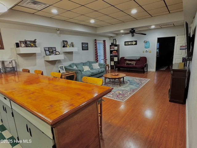 955 Mt Pisgah Rd SW, Supply, NC 28462 - living room with a ceiling fan, wood finished floors, and a paneled ceiling