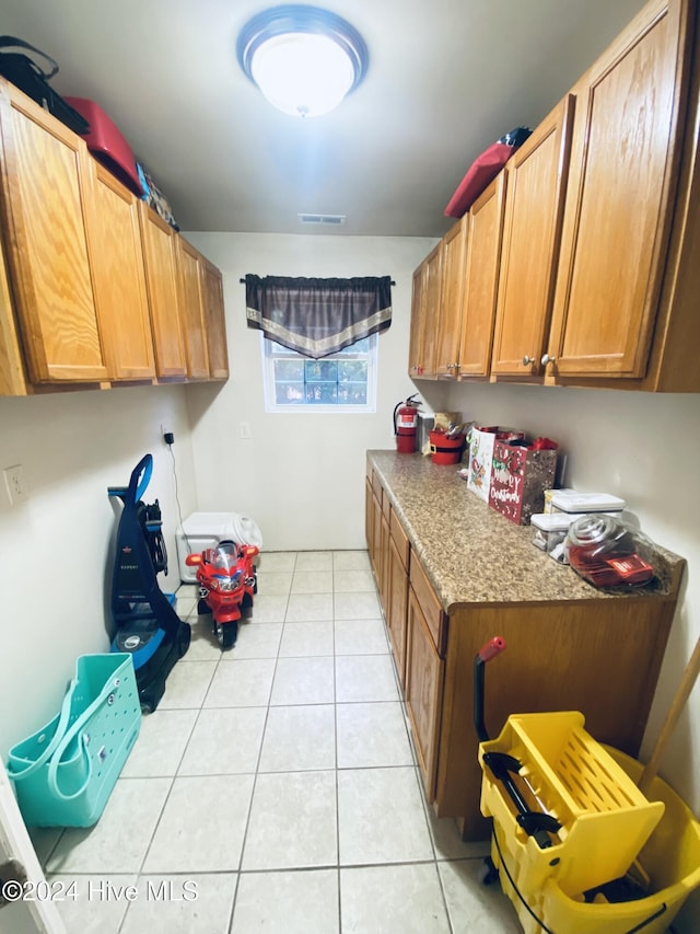 laundry room with light tile patterned flooring