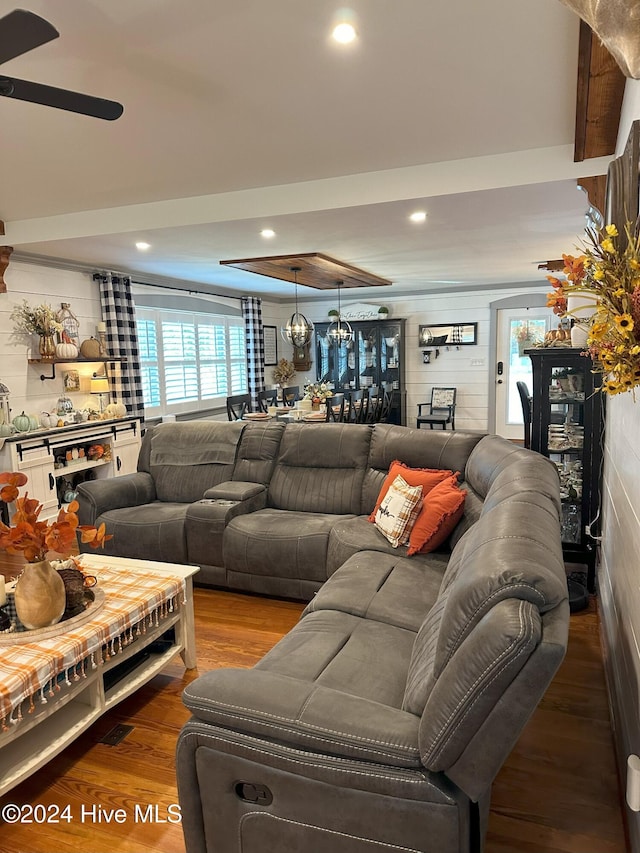 living room featuring hardwood / wood-style flooring and ceiling fan
