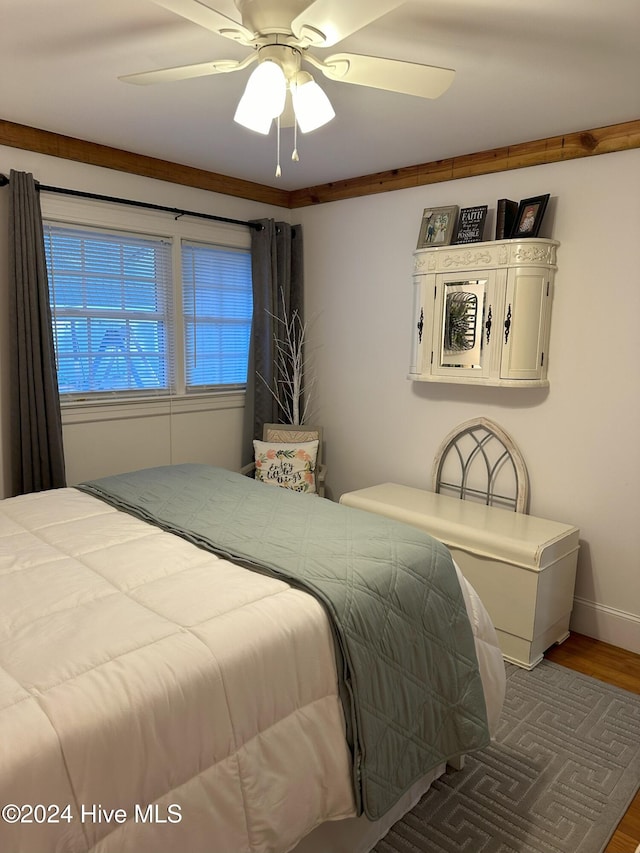 bedroom featuring hardwood / wood-style floors and ceiling fan