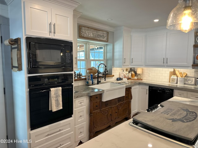 kitchen with sink, white cabinetry, and black appliances