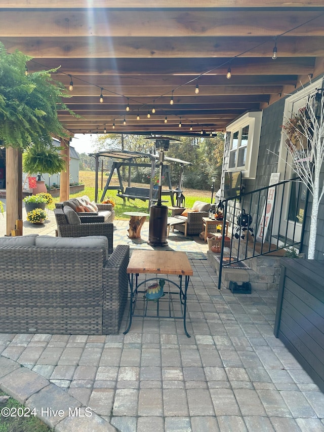 view of patio with a storage unit and a pergola