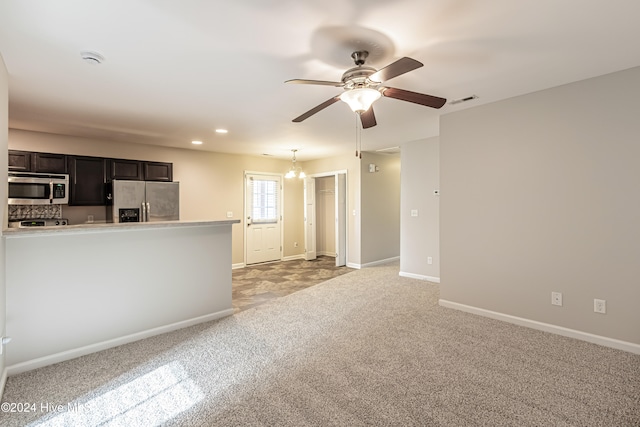 unfurnished living room featuring light carpet and ceiling fan