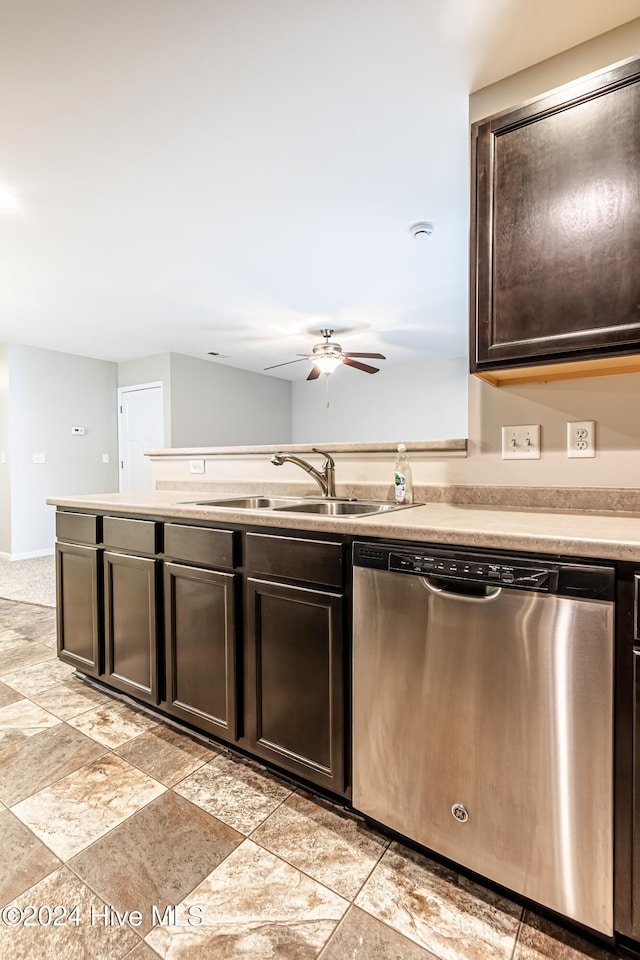 kitchen with stainless steel dishwasher, dark brown cabinets, sink, and ceiling fan