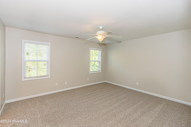 empty room featuring carpet and ceiling fan