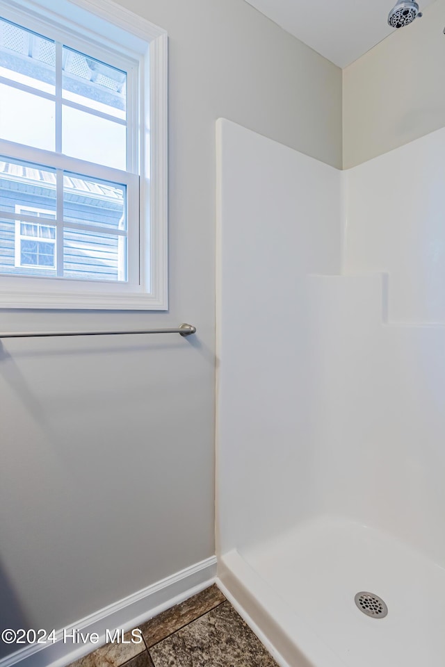 105 James Ave Unit A, Surf City, NC 28445 - bathroom featuring a shower and baseboards