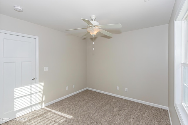 105 James Ave Unit A, Surf City, NC 28445 - unfurnished room with ceiling fan, carpet, a smoke detector, and baseboards