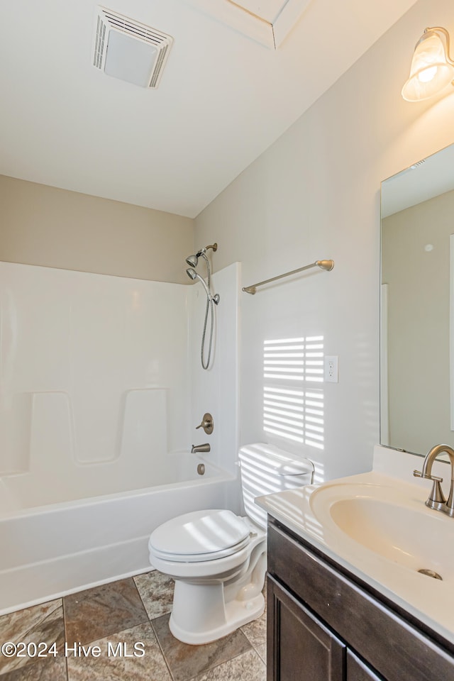 full bathroom with vanity, bathing tub / shower combination, and toilet